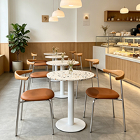 Ensemble de table à manger ronde en terrazzo avec chaises en cuir PU pour l'extérieur, hôtel, restaurant, mobilier