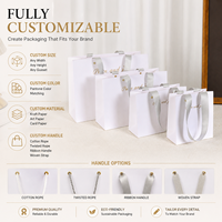 Sac en papier personnalisé en pâte de bois vierge blanche avec estampage à chaud pour cosmétiques, montres, sacs de luxe, poignée en ruban, sans commande minimum