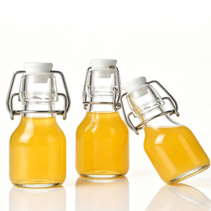 Bouteilles de shot de gingembre en verre réutilisables de 60 ml (2 oz) avec logo personnalisé, petits contenants hermétiques pour shots sains, avec bouchons pivotants hermétiques - Product Image 2