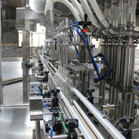 Machine de remplissage automatique de liquides de type linéaire pour spiritueux, jus de fruits, huile de cuisson avec machine de lavage de bouteilles