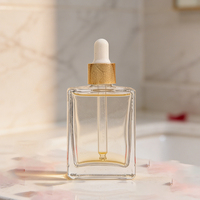 Flacon d'huile essentielle de luxe, sérum pour le soin de la peau, emballage en verre avec compte-gouttes