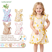 Robe débardeur à imprimé fruits mignons pour petites filles, avec volants aux épaules, ourlet festonné et nœud papillon, idéale pour les vacances et les jeux des enfants