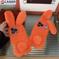 Nouveautés pour l'automne et l'hiver Style orange Fourrure mignonne Oreilles de lapin Étui pour appareil photo Support anti-chute Étui de téléphone pour Iphone17 16 15