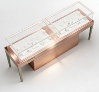Comptoir de présentation de bijoux LED en or rose de luxe avec dimensions personnalisables, vitrine en verre durable pour les bijouteries et les centres commerciaux