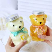 Fabricant chinois clair 200ml 250ml 300ml 350ml 400ml 450ml 500ml Bouteille en plastique de jus PET de qualité alimentaire sans Bpa avec bouchon