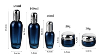 Bouteilles de crème pour le visage en verre bleu foncé, flacons pompe à lotion avec bouchon argenté, pour emballages cosmétiques et soins de la peau, directement de l'usine.
