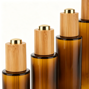 Vente en gros de flacons compte-gouttes en verre ambré vides avec bouchons en bambou pour les parfums, les soins de la peau et les sérums - Product Image 4