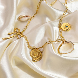 สร้อยคอเหล็กไทเทเนียมธีมเปลือกหอย ชุบทอง 18K จี้รูปโบว์และหอยสังข์ เครื่องประดับสำหรับงานปาร์ตี้ของผู้หญิง - Product Image 3