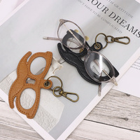 Porte-lunettes unique en cuir PU vintage et pendentif créatif pour sac avec mousqueton et porte-clés, idéal pour le rangement et la décoration des lunettes