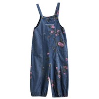 Nouvelle collection Printemps-Été 2026 : Salopette en jean rétro à imprimé floral pour femme, multi-poches, coupe ballon ample, chic et décontractée.