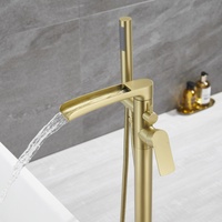 Robinet de baignoire autoportant en laiton doré brossé, montage sur une seule planche, avec bec cascade et douchette à main, pour usage hôtelier