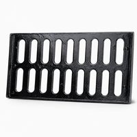 Grille de drainage en fonte robuste à charnières avec cadre pour la sécurité routière et les canaux de drainage