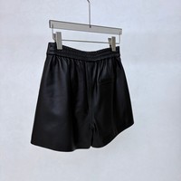 Shorts en cuir classiques pour femmes avec boutons pression, poches latérales, taille élastique au dos, style décontracté urbain pour tous les jours