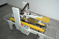 Machine de fermeture et d'étanchéité automatique de boîtes en carton, petite, électrique, avec tête de ruban adhésif de 50 mm pour les applications de boissons et de produits chimiques