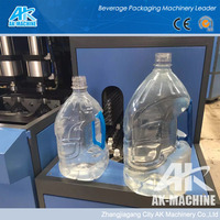 Machine de soufflage de bouteilles en plastique PE/PET semi-automatique 4-6L avec PLC et composants pour bouteilles de gallon