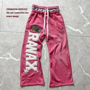 Pantalon de survêtement évasé en coton avec logo brodé personnalisé, effet vieilli et imprimé vintage, style streetwear du fabricant - Product Image 1