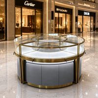 Vitrine à bijoux ronde haut de gamme en verre, comptoir d'exposition modulaire doré, aménagement intérieur de magasin de luxe