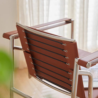 Fauteuil d'appoint en cuir minimaliste au design industriel avec structure en acier inoxydable pour salon et chambre à coucher