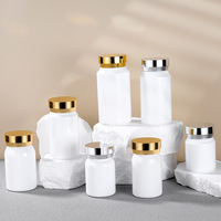 Récipient de capsule PET blanc personnalisé avec bouchon en or bouteille vide en plastique de supplément de vitamine pilule pour la médecine emballage de qualité