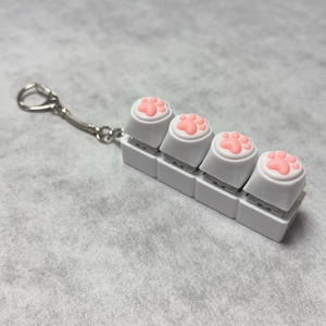 Porte-clés anti-stress en plastique souple à quatre boutons en forme de patte de chat, pendentif de décompression, manuel pour fournitures d'entraînement des animaux de compagnie - Product Image 2