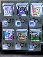 Machine de jeu distributrice en métal de haute qualité pour enfants avec capsules de 50-80 mm, garantie 1 an, interface en anglais