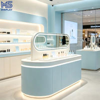 Comptoir d'îlot ovale personnalisé pour magasin de cosmétiques avec éclairage LED et étagère murale multi-niveaux pour boutique de cosmétiques