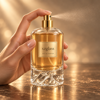 Flacon de parfum cylindrique de luxe en verre avec base sculptée en forme de montagne, bouchon en galet doré, sérigraphie, 30ml 50ml 100ml pour parfum