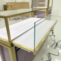 Ensemble de vitrines à bijoux HZD de luxe en fer/acier inoxydable plaqué titane avec éclairage LED pour bijouteries haut de gamme en centre commercial