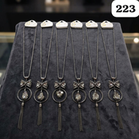 Collier long de luxe PingBling en métal canon de fusil avec nœud en cristal, double anneau, pendentif goutte facetté fumé, chaîne à pampilles et motif floral pour femme