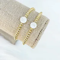 Bracelet de perles en acier inoxydable plaqué or 18 carats imperméable à l'eau sans ternissure bijoux élastiques personnalisés pour femmes