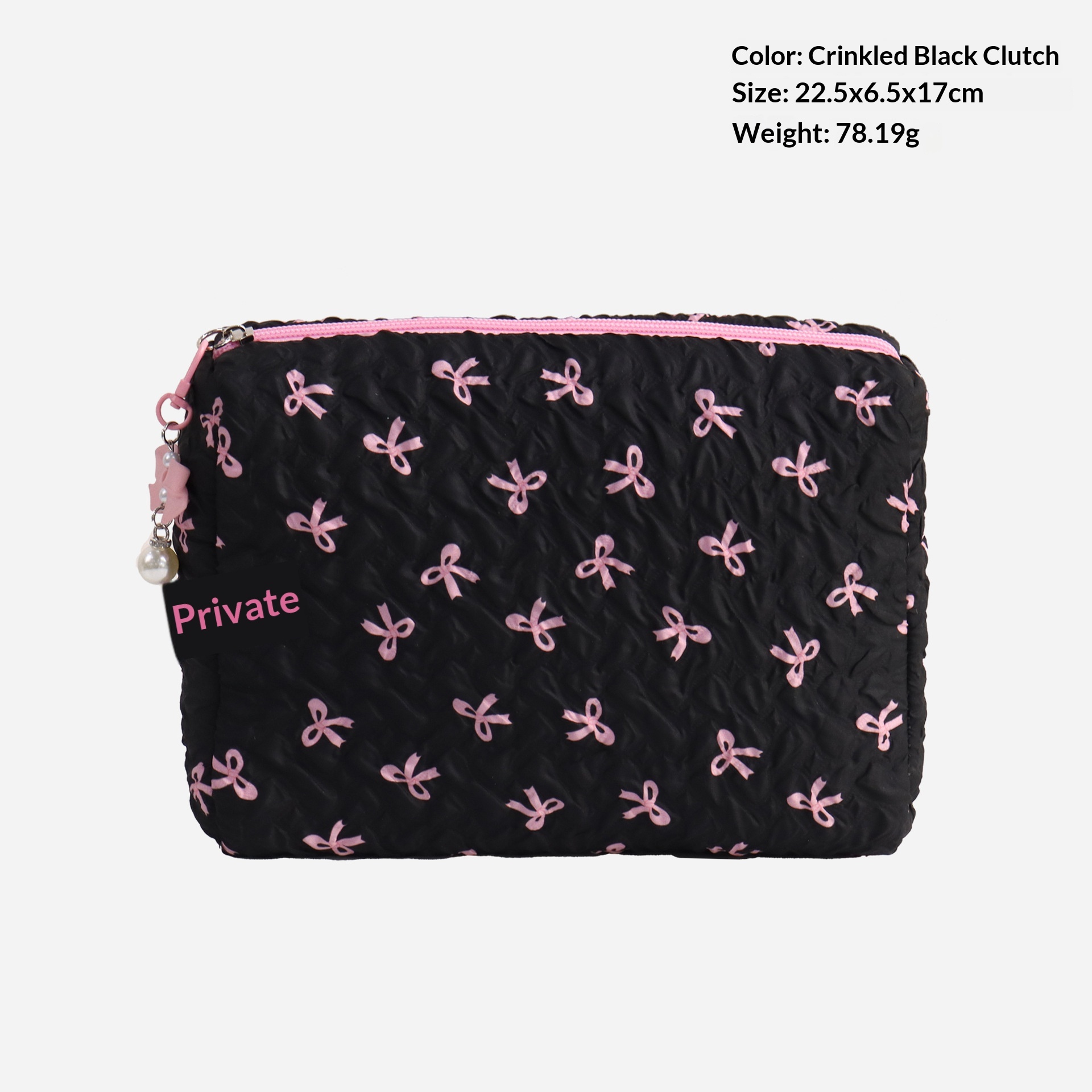 Sac à main noir et rose avec nœud.