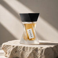 Flacon de parfum vide de luxe noir brillant torsadé géométrique sculptural à facettes avec base en verre lourd, lettrage doré, logo personnalisé