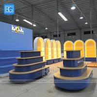Meubles de présentation de vente au détail personnalisés, étagères de magasin en bois bleu à plusieurs niveaux, conception de présentoir de rangement avec tiroir