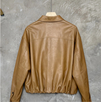 Veste en peau de mouton pour femme, marron caramel, col chemise, poche poitrine unique, ourlet à cordon, épaules tombantes, coupe ample, manteau court en cuir