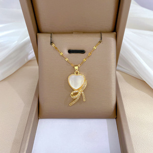 Colar de <span class=keywords><strong>laco</strong></span> mignon brillant diamant incrustation nœud collier 18K plaqué or chaîne en acier inoxydable oeil de chat pierre coeur arc collier - Product Image 2