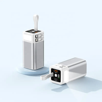 Batterie externe portable 20000mAh en alliage d'aluminium ultra-mince noire avec charge rapide, entrée Micro USB, câbles intégrés et 4 sorties