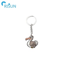 Fabrication de porte-clés en métal émaillé en forme d'oiseau Dodo, Llavero, animal sans ailes et sans peur, porte-clés Dodo souvenir, porte-clés Dodo personnalisé