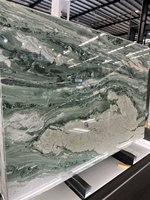 Dalle de marbre naturel vert poli avec veines grises et noires, découpée sur mesure pour comptoir de cuisine, mur et sol