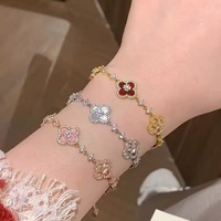 Bracelet porte-bonheur trèfle à quatre feuilles creux en coquille brillante incrustée de pierres roses exquises, cadeau de niche pour femme