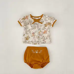 Conjunto de duas peças com laço floral para meninas, top de manga curta com gola redonda e calças bordadas, novo estilo primavera verão 2024