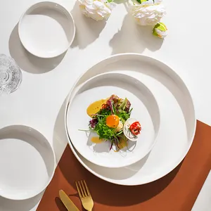 Jinbaichuan grosir pabrik alat makan khusus piring keramik porselen putih bulat piring makan malam untuk Hotel restoran