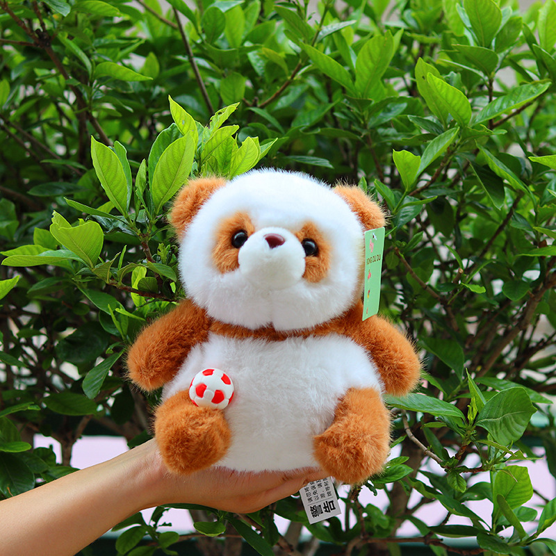 Panda couché marron et blanc [poupée]