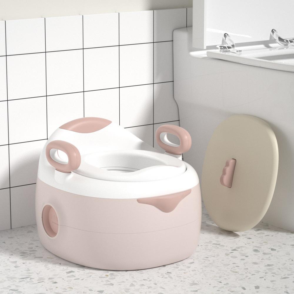 เบาะสีชมพูสามในหนึ่งในห้องน้ำ