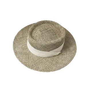 Travel Natural seagrass hollow flat brim hat ladies summer porkpie concave round sun hat beach straw hat with ribbon wholesale