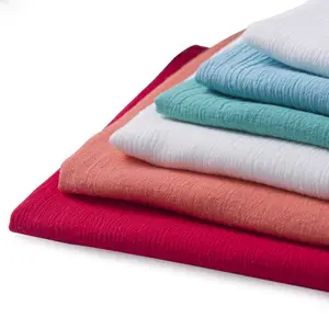 Tissu de crêpe de coton lavé par couleur unie pour les vêtements de mode des femmes de printemps et d'été