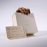 Boîte de papier en carton pliable noire de luxe recyclable HX personnalisée Logo en relief et fermeture magnétique pour l'emballage de produits de beauté