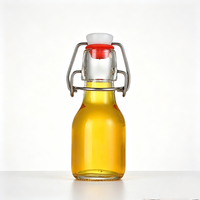 Bouteille en verre vide réutilisable de 60 ml (2 oz) avec bouchon à bascule hermétique, mini bouteille en verre pour boissons, lait, jus, kombucha