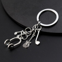 Porte-clés en alliage de zinc avec motif musical, petit cadeau, pendentif, casque, violon, microphone, combinaison musicale, vente chaude