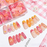 120 faux ongles à presser, boîte à 4 compartiments, forme amande moyenne, rose doux et jaune, motifs cerise, cœur et floral, pré-dessinés