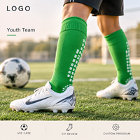 Chaussettes de football renforcées pour équipes de jeunes, vert vif, à profil fin, pour une adhérence sécurisée sur terrain, avec base de crampons et conception graduée pour la taille